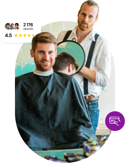 Man in barbershop with barber showing him haircut in a mirror